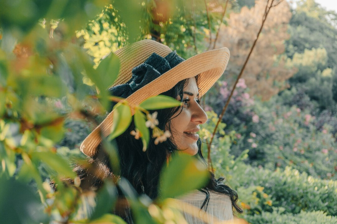 Smiling Latina woman looking at the camera in a bright room