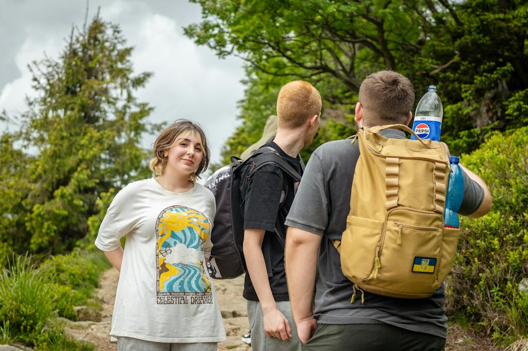 Group of friends laughing together outdoors